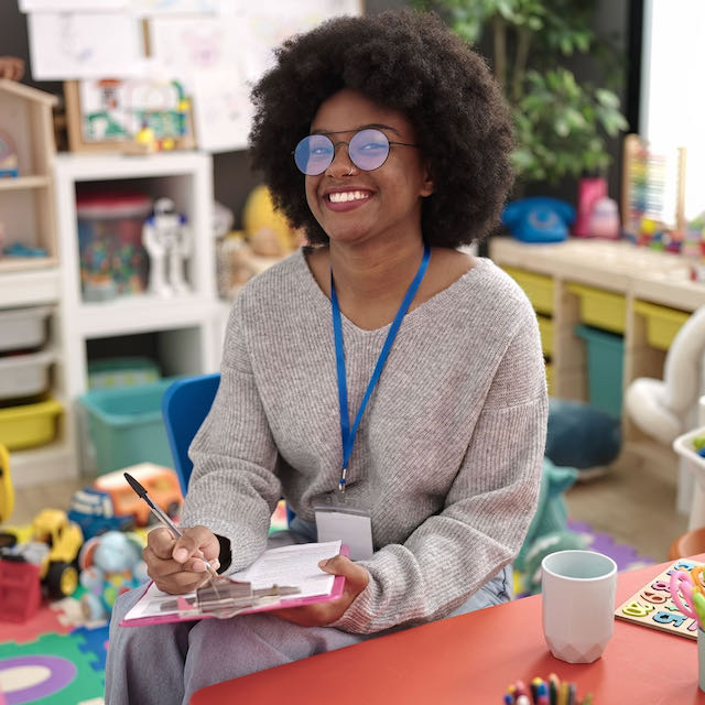 Smiling woman scheduling a tour of Learning Ladder Christian Preschool