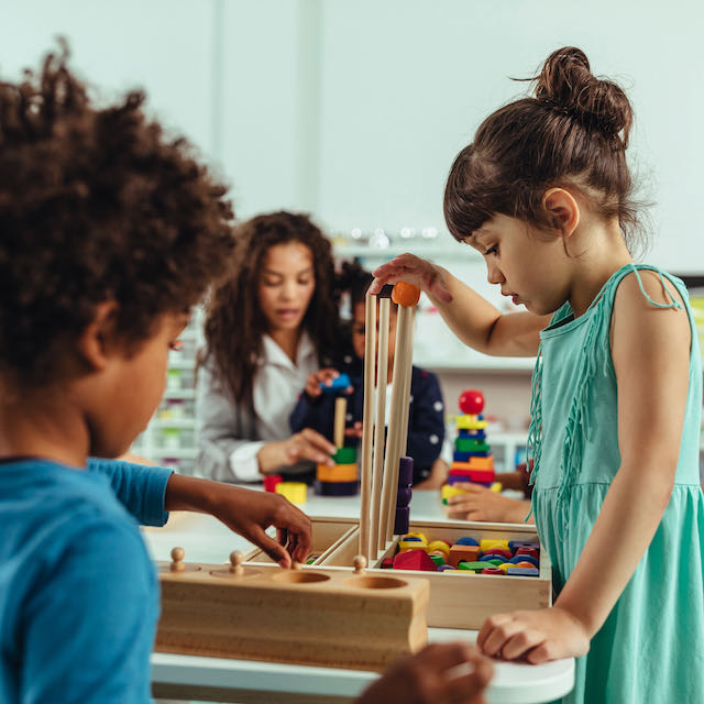 Children engaged in hands-on learning, exploring and discovering at Learning Ladder Christian Preschool